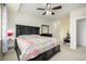 Spacious bedroom offers natural light, carpet, and neutral walls at 804 Summer Hawk Dr # 303, Longmont, CO 80504