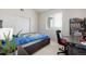 Bright bedroom with a large window, closet, desk, and stylish bookcase at 804 Summer Hawk Dr # 303, Longmont, CO 80504