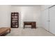 Bright bedroom featuring a bookshelf, desk, and closet with white doors at 804 Summer Hawk Dr # 303, Longmont, CO 80504