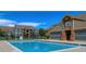 A bright community pool area with a clear blue swimming pool at 804 Summer Hawk Dr # 303, Longmont, CO 80504