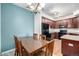 Dining room area with table and view of the modern kitchen at 804 Summer Hawk Dr # 303, Longmont, CO 80504