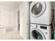 Laundry room with stacked washer and dryer, and storage space at 804 Summer Hawk Dr # 303, Longmont, CO 80504