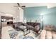 Cozy living room with colorful rug, sofa and connecting kitchen at 804 Summer Hawk Dr # 303, Longmont, CO 80504