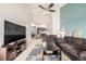 Comfortable living room featuring a ceiling fan and cozy furniture at 804 Summer Hawk Dr # 303, Longmont, CO 80504