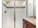 Modern bathroom featuring glass enclosed shower with tiled walls and stylish vanity at 804 Summer Hawk Dr # 303, Longmont, CO 80504