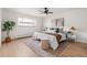 Well-lit bedroom with modern ceiling fan, stylish rug, and comfortable furnishings, creating a serene retreat at 7050 W Cedar Ave # 108, Lakewood, CO 80226