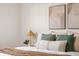 Bright bedroom decor showcasing a comfy bed with decorative pillows and a charming bedside lamp at 7050 W Cedar Ave # 108, Lakewood, CO 80226