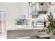 Bright kitchen featuring sleek countertops, stainless steel appliances, and barstool seating at 7050 W Cedar Ave # 108, Lakewood, CO 80226