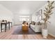 Bright and spacious living room with modern decor, natural light, and sleek flooring at 7050 W Cedar Ave # 108, Lakewood, CO 80226