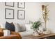 Stylish living room with a comfortable sofa, decorative pillows, and a wood coffee table at 7050 W Cedar Ave # 108, Lakewood, CO 80226