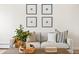 Comfortable living room featuring a sofa, throw pillows, and decorative artwork at 7050 W Cedar Ave # 108, Lakewood, CO 80226