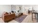 Open floor plan showcasing the living room, dining area, and kitchen at 7050 W Cedar Ave # 108, Lakewood, CO 80226