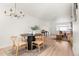 Open-concept living space features a dining area that connects to the living room and bright interiors at 7050 W Cedar Ave # 108, Lakewood, CO 80226
