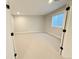 Basement with neutral carpet and a window at 6023 Chester Way, Denver, CO 80238