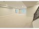 Spacious finished basement with recessed lighting and stairs leading to the upper level at 6023 Chester Way, Denver, CO 80238