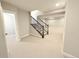 Finished basement with neutral carpet, recessed lighting, and access to the upper levels via a staircase at 6023 Chester Way, Denver, CO 80238