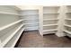 Spacious walk-in pantry with ample shelving, providing plenty of storage space for kitchen essentials at 6023 Chester Way, Denver, CO 80238
