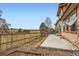Spacious backyard with a wooden fence, concrete patio, and a view of the neighborhood at 10677 Cedarcrest Cir, Highlands Ranch, CO 80130