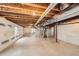 Unfinished basement with exposed ceiling, concrete floor, and wrapped walls at 10677 Cedarcrest Cir, Highlands Ranch, CO 80130