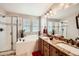 Modern bathroom featuring a shower, tub, double vanity, and stylish fixtures at 10677 Cedarcrest Cir, Highlands Ranch, CO 80130