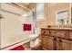 Bathroom featuring glass shower door, double vanity, and decorative tile accents at 10677 Cedarcrest Cir, Highlands Ranch, CO 80130