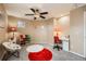 Cozy bedroom with gray carpet, neutral walls, ceiling fan, and space for a desk at 10677 Cedarcrest Cir, Highlands Ranch, CO 80130