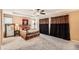 Primary bedroom boasts tray ceiling, plush carpeting, ceiling fan and elegant window treatments at 10677 Cedarcrest Cir, Highlands Ranch, CO 80130