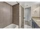 Bathroom featuring tiled shower with a tub and a granite-topped vanity at 3337 S Monaco Pkwy # C, Denver, CO 80222