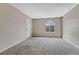 Neutral bedroom with plush carpet, window, closet door and fresh paint at 3337 S Monaco Pkwy # C, Denver, CO 80222