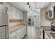 Updated kitchen with granite counters, stainless appliances, and access to an outdoor deck at 3337 S Monaco Pkwy # C, Denver, CO 80222