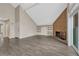 Open concept living room featuring a fireplace, shelving, and wood-style flooring at 3337 S Monaco Pkwy # C, Denver, CO 80222
