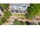 Aerial view of the backyard featuring a deck, mature landscaping, and fenced yard at 24022 E Jamison Dr, Aurora, CO 80016