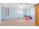 Bright basement playroom with carpet, a window for natural light, and space for to play at 24022 E Jamison Dr, Aurora, CO 80016