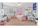 Bright bedroom with pink accents, carpeted floors, and ample space for study and relaxation at 24022 E Jamison Dr, Aurora, CO 80016