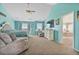 Bright, spacious bedroom with large windows, neutral carpeting, and a view into the attached bathroom at 24022 E Jamison Dr, Aurora, CO 80016