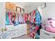 Walk-in closet with ample hanging space and drawers, offering generous storage and organization at 24022 E Jamison Dr, Aurora, CO 80016