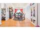 Sunlit dining room featuring a chandelier, tray ceiling, and view at 24022 E Jamison Dr, Aurora, CO 80016