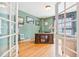 Cozy office with french doors, hardwood floors, and built in bookcase at 24022 E Jamison Dr, Aurora, CO 80016