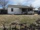 View of the home and backyard, showing the backyard and exterior features of the property at 7080 Cherry St, Commerce City, CO 80022