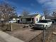 View of the home and front yard, showing the front yard and exterior features of the property at 7080 Cherry St, Commerce City, CO 80022