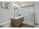 Bathroom with a glass enclosed shower, modern vanity, and sleek fixtures at 5271 S Logan St, Littleton, CO 80121