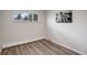 Bedroom featuring a window, neutral colors, and modern vinyl plank flooring at 5271 S Logan St, Littleton, CO 80121