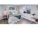 Bedroom with big window providing natural light, sleek flooring, and neutral wall color at 5271 S Logan St, Littleton, CO 80121