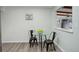 Cozy dining area features a contemporary glass table, modern decor, and an open layout leading to other living spaces at 5271 S Logan St, Littleton, CO 80121
