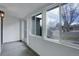 Bright foyer with white walls, gray tile floors, and views of the yard at 5271 S Logan St, Littleton, CO 80121