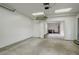 Spacious garage with concrete floors, ample lighting, and a separate room for storage or a workshop at 5271 S Logan St, Littleton, CO 80121