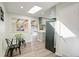 Open kitchen showcasing wood-look flooring, stainless steel appliances, a stylish backsplash, and great natural light at 5271 S Logan St, Littleton, CO 80121