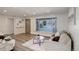 Cozy living room featuring bright interior, modern finishes, and large picture window at 5271 S Logan St, Littleton, CO 80121
