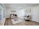 Open-concept living area featuring an open layout with wood floors and natural light at 5271 S Logan St, Littleton, CO 80121