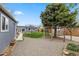 Backyard featuring a pergola and lush foliage for outdoor entertainment or relaxation at 835 S Shoshone St, Denver, CO 80223